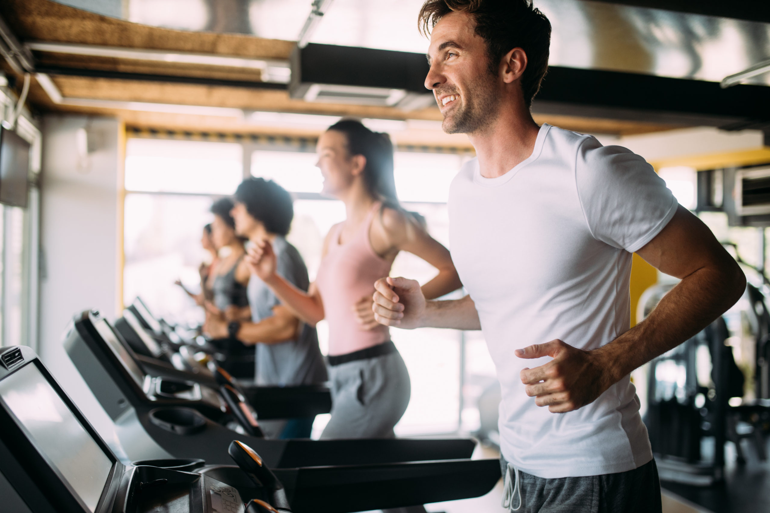 Group of sportive people in a gym. Concepts about lifestyle and sport in a fitness club